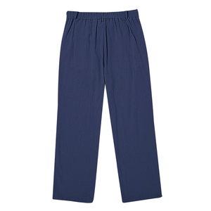 Close-up of navy blue linen trousers showing elastic waistband and fabric texture