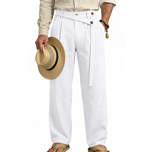 Close-up of white linen trousers featuring high-waisted pleats and a decorative brown belt