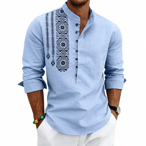Detailed view of light blue linen shirt with navy ethnic geometric print on chest