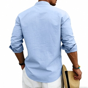 Detail view of light blue linen shirt texture and relaxed fit on model back