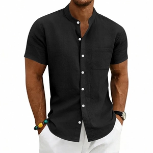 Detailed view of black linen shirt featuring a mandarin collar and contrast white buttons