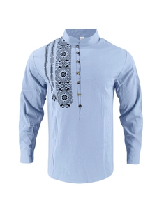 Detailed view of mandarin collar and ethnic geometric embroidery on light blue linen shirt