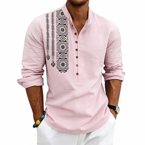 Detail of pink bohemian linen Henley shirt featuring black ethnic geometric chest print