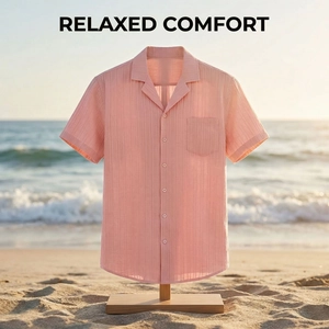 Detail of light pink short-sleeve shirt featuring textured vertical stripes and a chest pocket