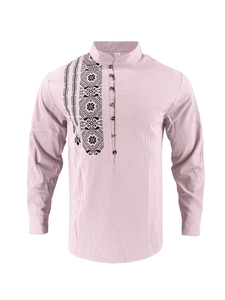 Detail view of pink linen shirt featuring ethnic geometric embroidery and wooden buttons
