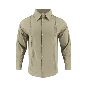 Detail of olive green linen shirt featuring vertical hollow-out embroidery and texture