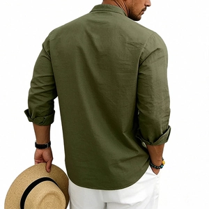 Detail of army green linen henley shirt showing textured fabric and casual rolled sleeves