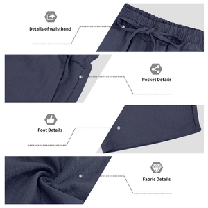 Detailoverzicht van marineblauwe linnen broek met trekkoord, zakken en de textuur van de stof