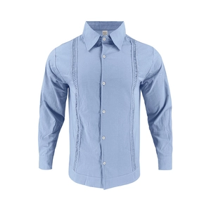 Detail of light blue linen shirt featuring vertical embroidery and classic white buttons