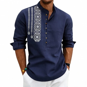 Detail of navy linen shirt with white geometric embroidery and wooden buttons