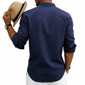 Detail of navy blue linen blend shirt featuring stand collar and curved hem in a casual style