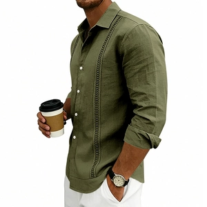 Detail of army green linen shirt showing vertical textured embroidery and white buttons
