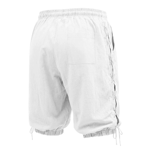 Short en lin blanc avec laçage latéral et cordon de serrage réglable au bas des jambes