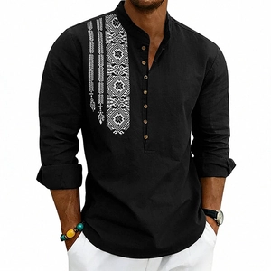 Close-up of black linen shirt featuring white geometric embroidery and wood buttons