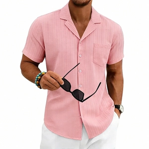 Detail of pink Cuban collar shirt featuring vertical stripe texture and chest pocket