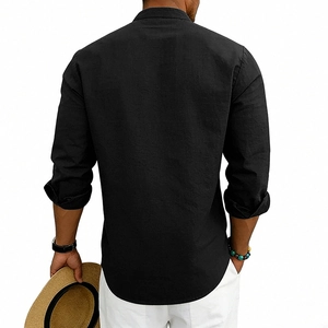 Rear view of men's loose linen Henley shirt in black, paired with white casual trousers