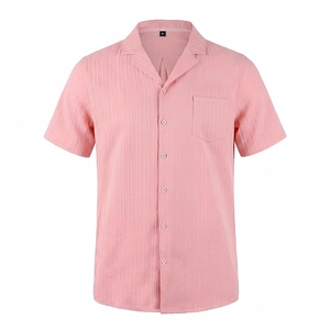 Detailed view of pink men's Cuban collar shirt with textured vertical fabric and chest pocket