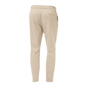Detail view of khaki men's chinos showing back pocket, elastic waist, and cotton fabric texture