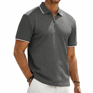 Men's dark grey short sleeve polo shirt with chevron knit and half-zip collar detail