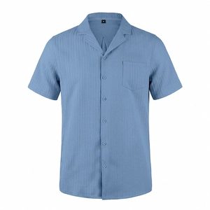 Detailed macro view of light blue seersucker textured fabric on men's short sleeve shirt