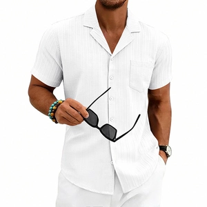 Detail of white Cuban collar shirt with waffle texture fabric and chest pocket for men