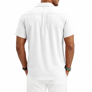 Close-up of white seersucker men shirt showing textured fabric and Cuban collar detail