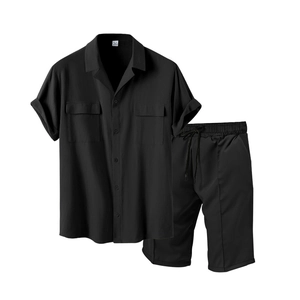 Detail of black short sleeve shirt set with dual chest pockets and textured fabric
