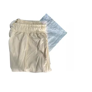 Detail of cream elastic drawstring waistband and moisture-proof packaging paper