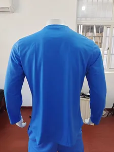Back view of a blue long-sleeve athletic shirt for men with slim fit design