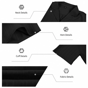 Detail view of black Cuban collar shirt showing vertical stripe texture and sleeve hem