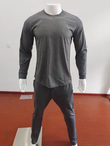 Close-up of men's dark grey sports tracksuit with long sleeve top and jogger pants