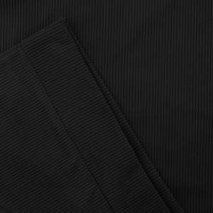Close-up of the black ribbed knit cuffs and dense fabric texture on the stylish sweatshirt