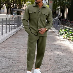 Close-up of army green faux suede jacket showing chest pockets and button details