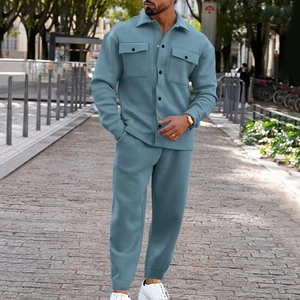 Close-up of men's casual blue suede-textured jacket set featuring buttoned flap chest pockets