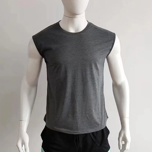 Detail view of dark grey sleeveless crew neck sports vest with knit blend texture
