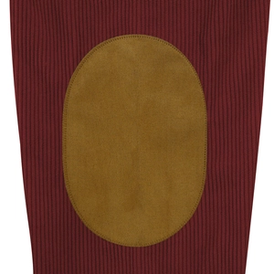 Detail of burgundy ribbed knit sleeve featuring a brown suede oval elbow patch