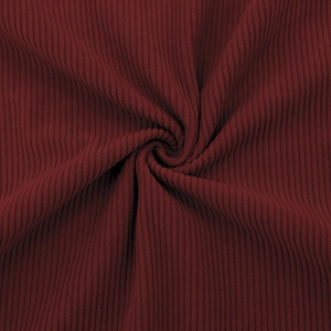 Detailed macro shot of dark red corduroy fabric texture with vertical ribbed structure