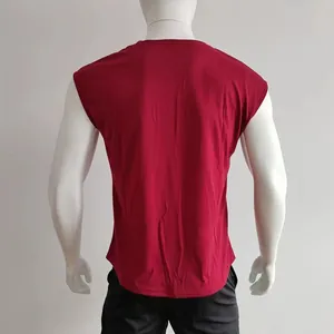 Detail view of the back of a red crew neck sleeveless T-shirt with a curved hemline