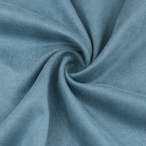 Detail of soft faux suede fabric in foggy blue showing smooth texture and drape