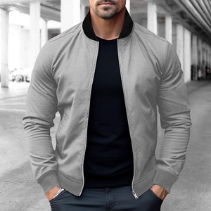 Close-up of lightweight grey bomber jacket with black ribbed collar and slim fit design