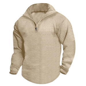 Close-up of men's apricot waffle knit sweatshirt with quarter-zip and ribbed cuffs