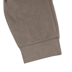 Close-up of taupe faux suede jacket ribbed cuffs with premium heavy cotton blend texture