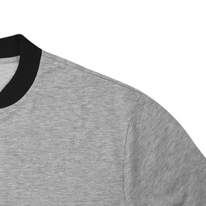 Detail shot of a heather grey jacket showing black ribbed neckline and shoulder stitching