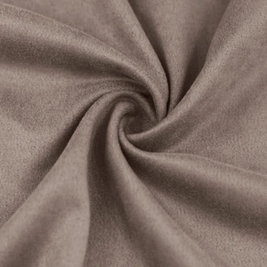 Close-up detail of premium taupe faux suede fabric texture with soft velvet-like finish