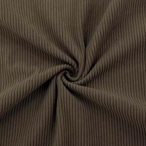 Close-up macro of dark brown ribbed knit fabric showing soft texture and thick vertical patterns