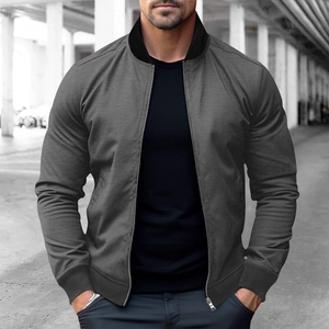 Detail of grey bomber jacket showing the ribbed collar and zip closure on male model