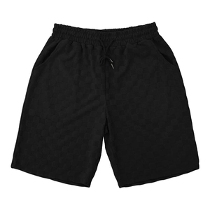 Detail of men's black waffle knit casual shorts with elastic drawstring waistband