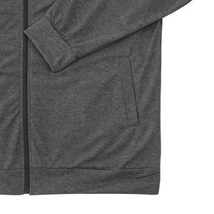 Detail shot of the dark grey bomber jacket featuring ribbed cuffs and zipper pockets