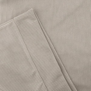 Close-up of ribbed knit texture and fine stitching on casual long sleeve sweatshirt