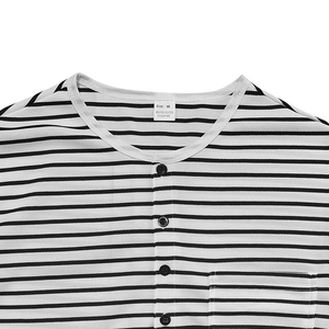 Close-up of Henley neckline with black and white stripes and functional button placket
